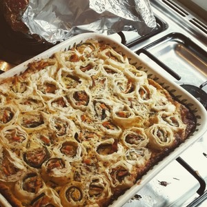 Creme fraiche quiche with zucchini and filo pastry rolls