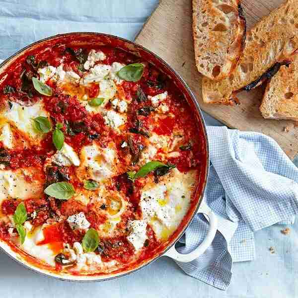 Baked eggs with spinach, tomatoes, ricotta & basil