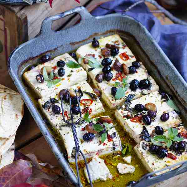 Baked feta with roasted garlic, chilli and olives