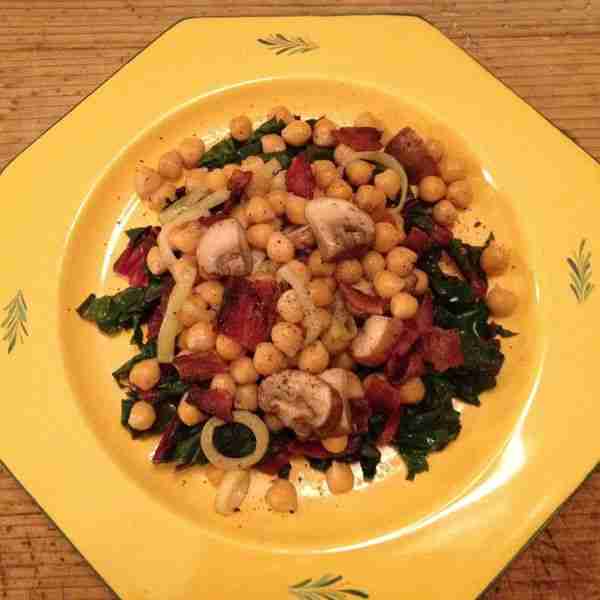 Chickpeas with bacon, portabellos and leeks over lemony swiss chard