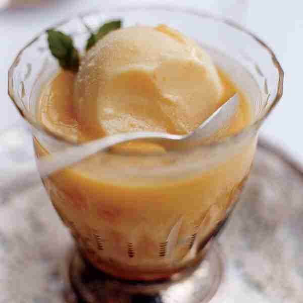 Liqueur-Infused Oranges with Ice Cream and Custard Sauce